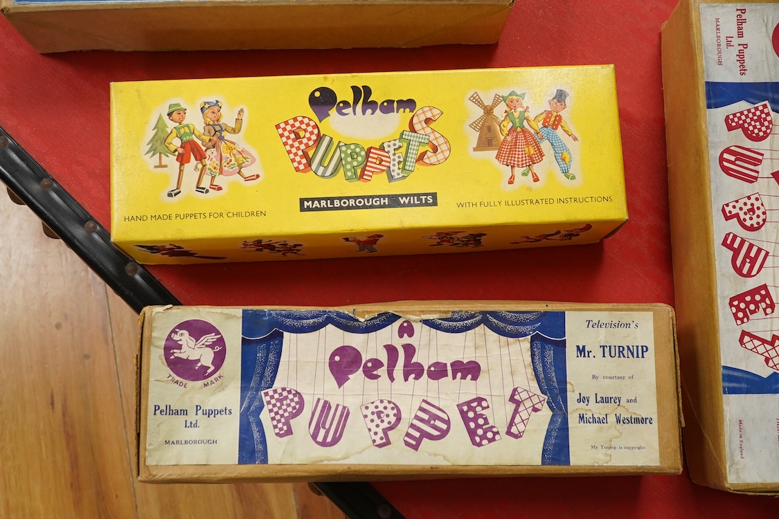 Five boxed Pelham Puppets including; a Type SL Hansel, Gretel, Bembo the Clown, the Policeman with moving mouth, Mr. Turnip